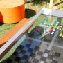 HPL Bench Chess and ludo game dengan papan catur dan ludo berwarna-warni di bangku taman.